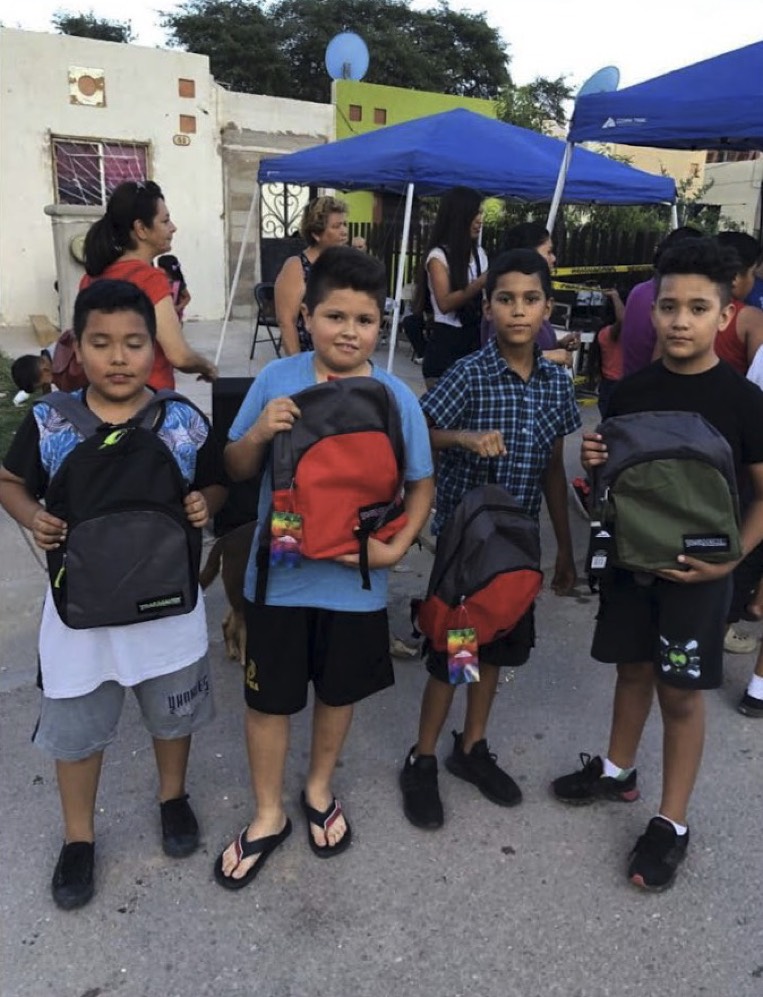 Back to school supplies for Indigenous Peoples Charity Girl with backpack