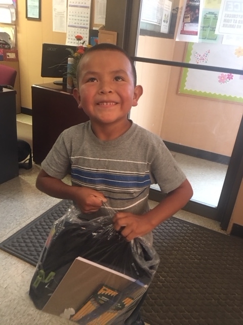 Happy boy with backpack for school